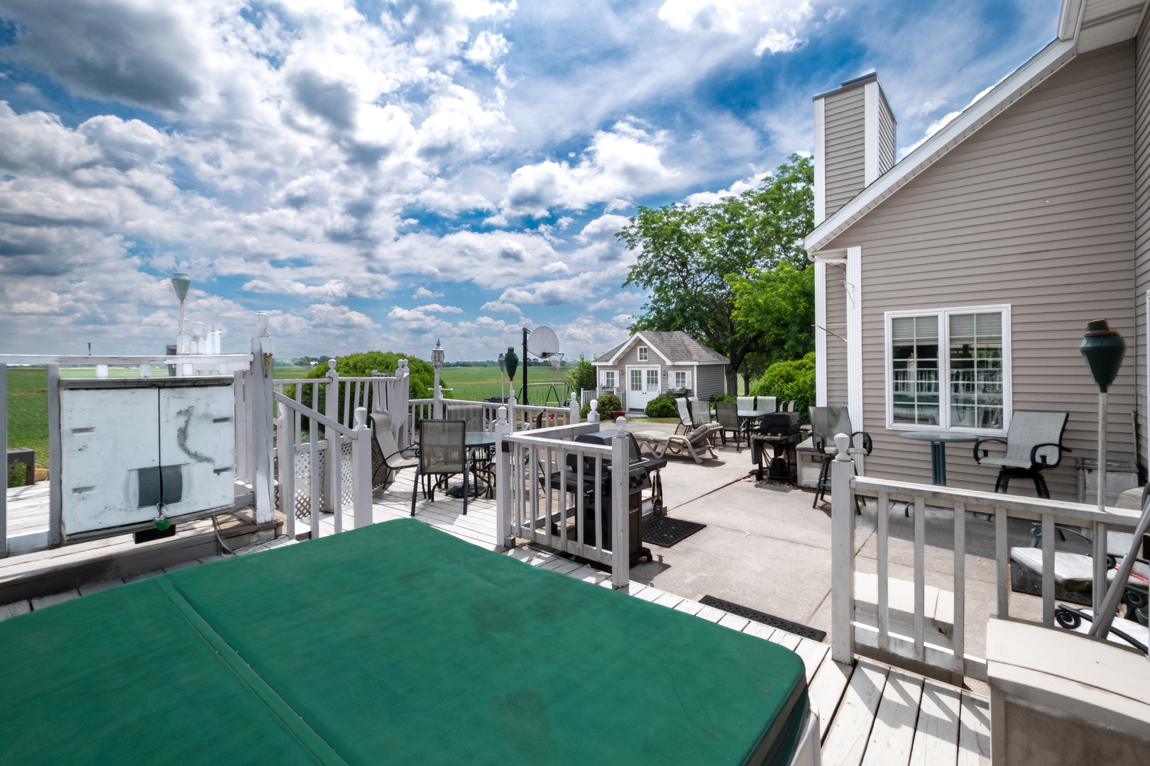 308 Calla Drive Manhattan, IL 60442 - Photo 24 of 30 a view of a patio with table and chairs potted plants and large tree