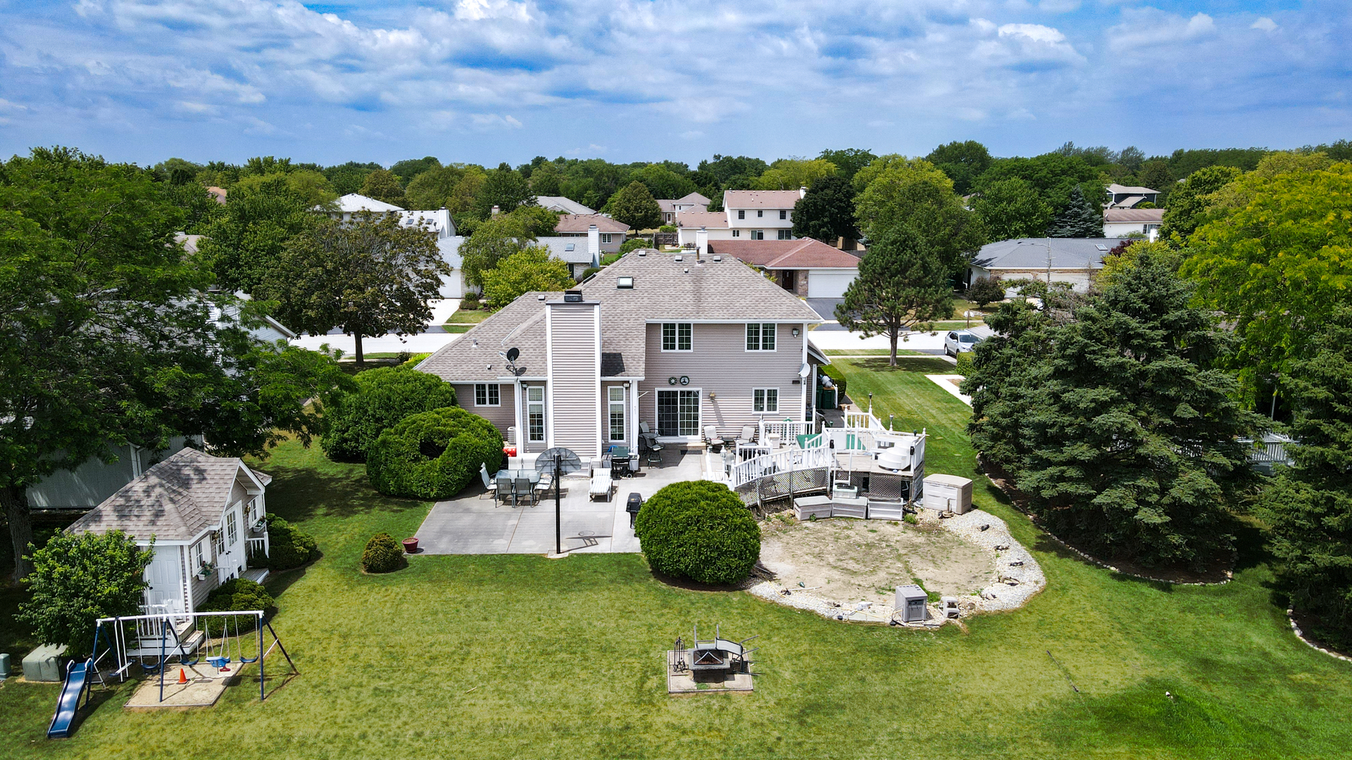 308 Calla Drive Manhattan, IL 60442 - Photo 26 of 30 a aerial view of a house with table and chairs and a potted plants