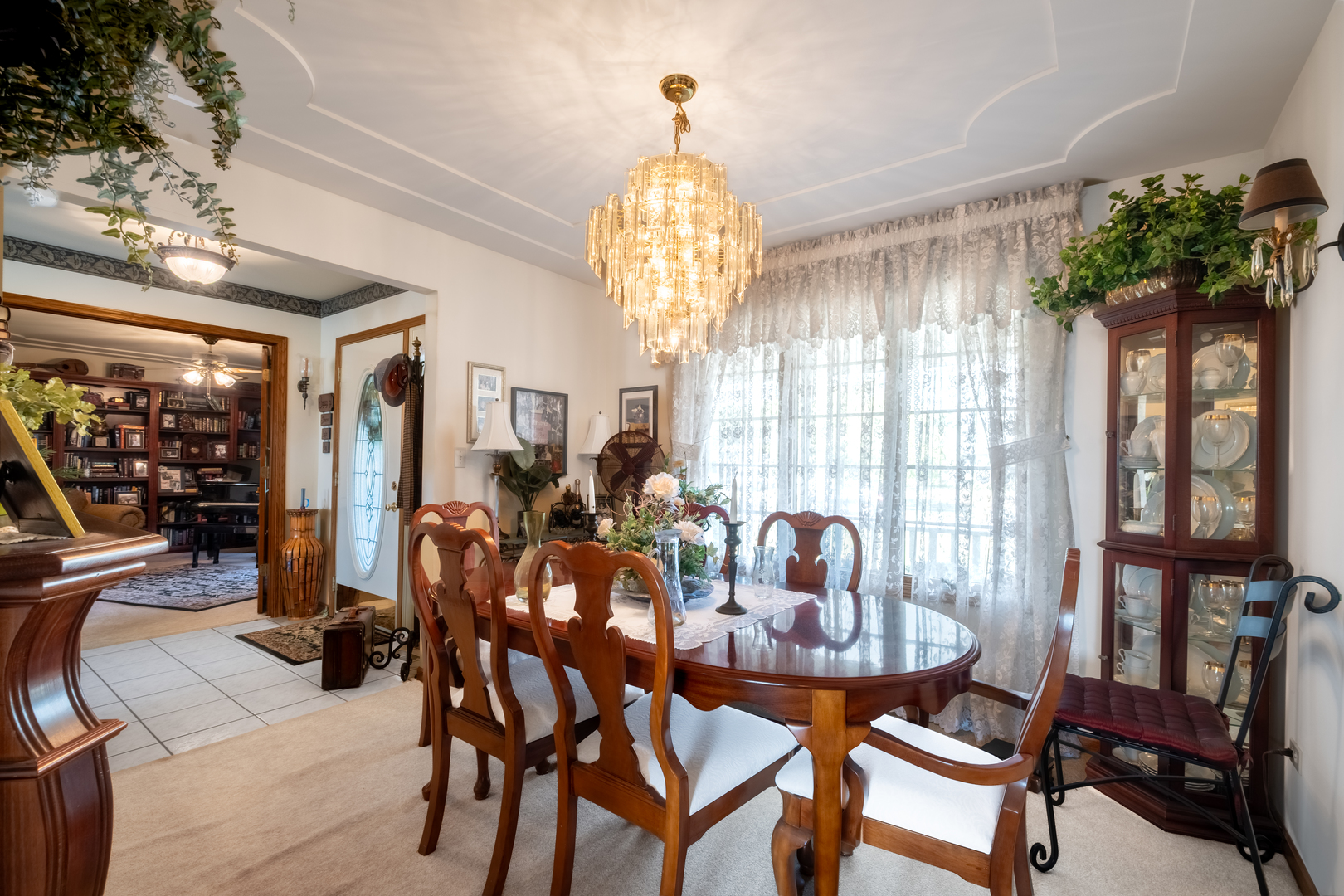 308 Calla Drive Manhattan, IL 60442 - Photo 8 of 30 a dining room with furniture potted plants and wooden floor