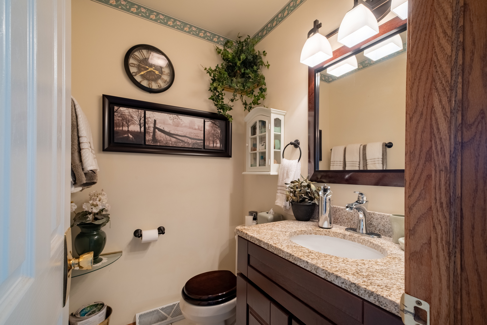 308 Calla Drive Manhattan, IL 60442 - Photo 9 of 30 a bathroom with a granite countertop sink and a mirror