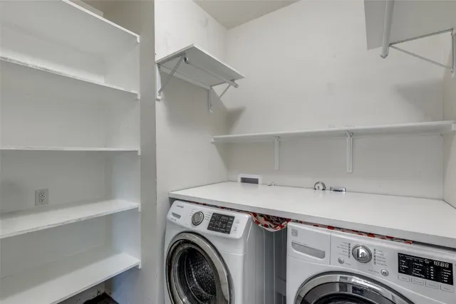 a bathroom with a sink a toilet a mirror and shower