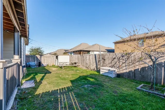 a view of a chair and tables in the balcony