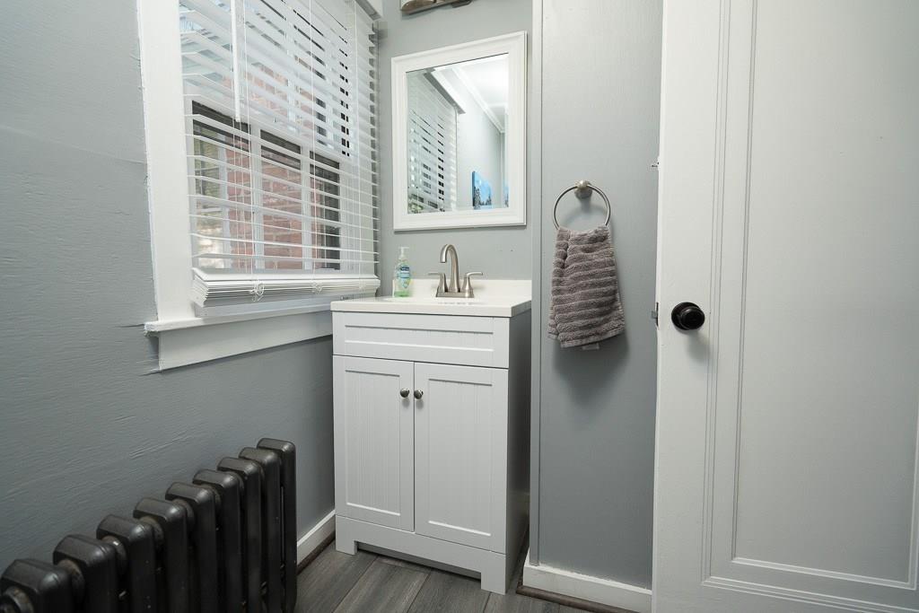19 Perkins Street Springfield, MA 01118 - Photo 13 of 29 a bathroom with a sink a toilet and window
