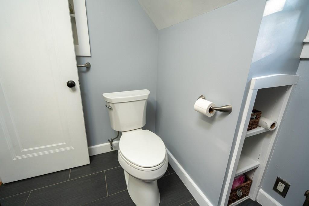 19 Perkins Street Springfield, MA 01118 - Photo 23 of 29 a white toilet sitting next to a small bathroom