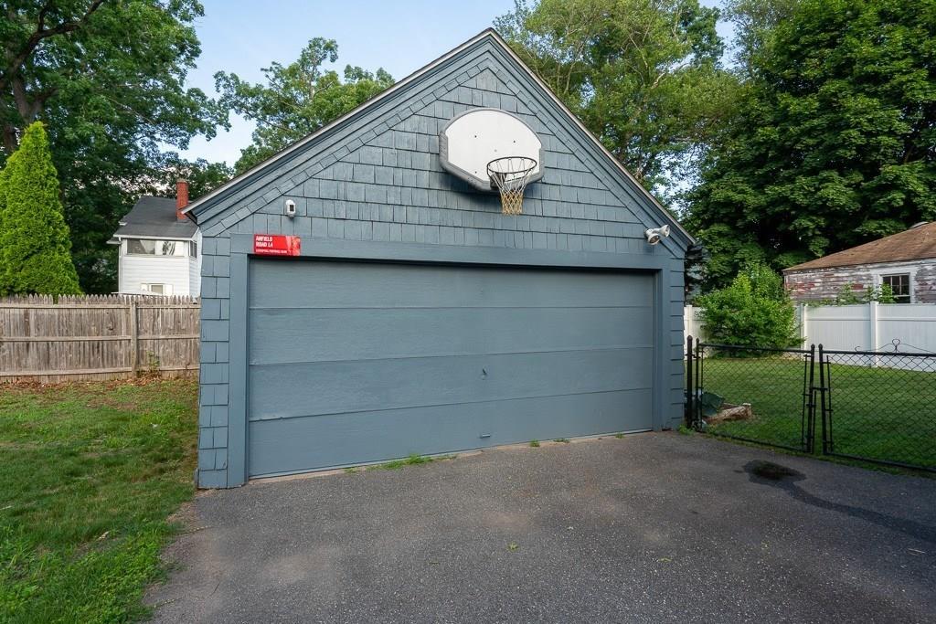19 Perkins Street Springfield, MA 01118 - Photo 25 of 29 a front view of a house with a garage