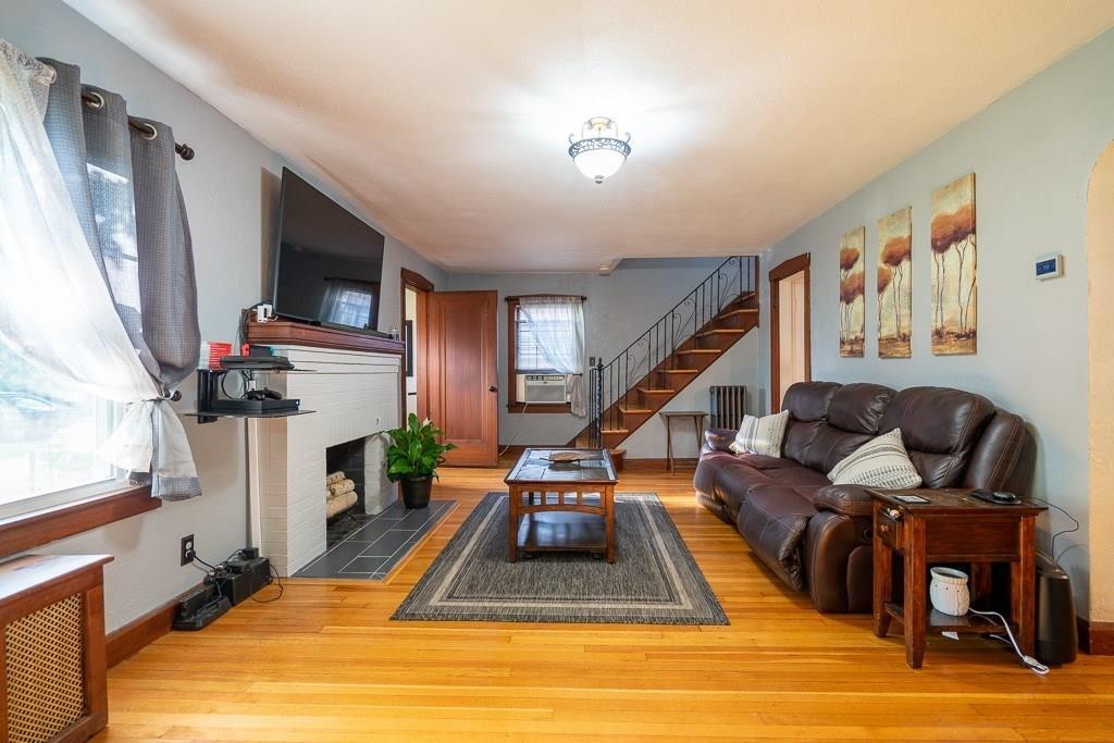 19 Perkins Street Springfield, MA 01118 - Photo 4 of 29 a living room with furniture and a flat screen tv