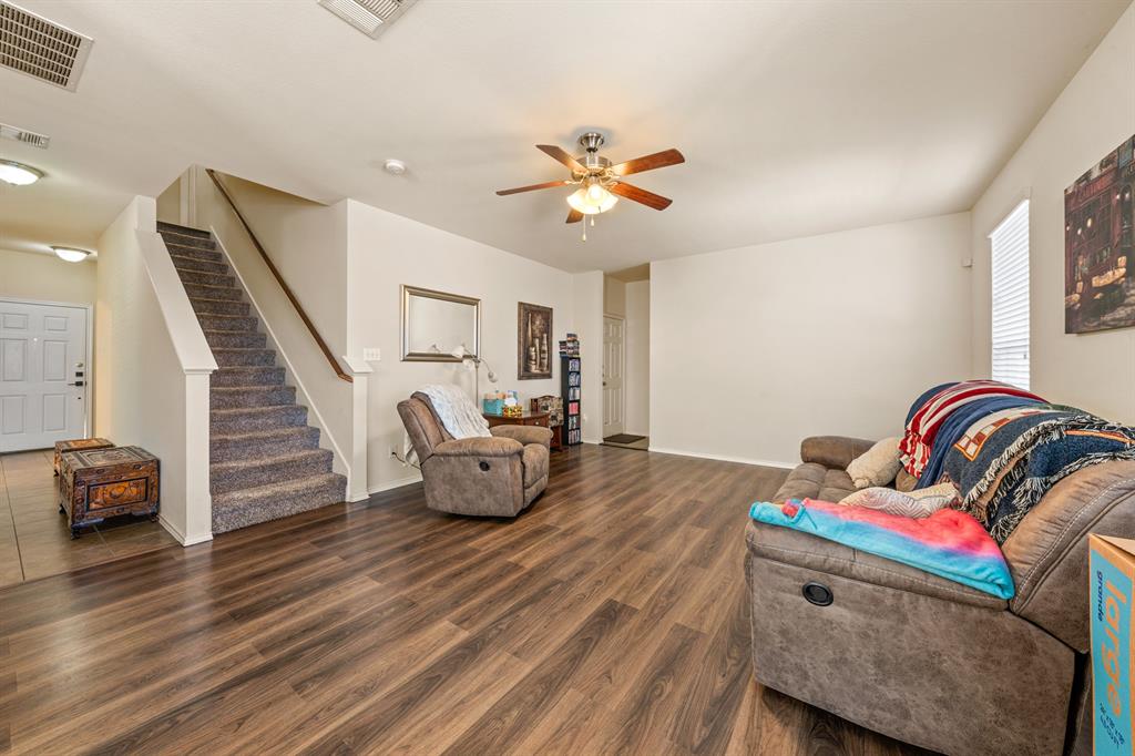 6544 Mundo Drive Waco, TX 76712 - Photo 6 of 21 a living room with furniture and a wooden floor