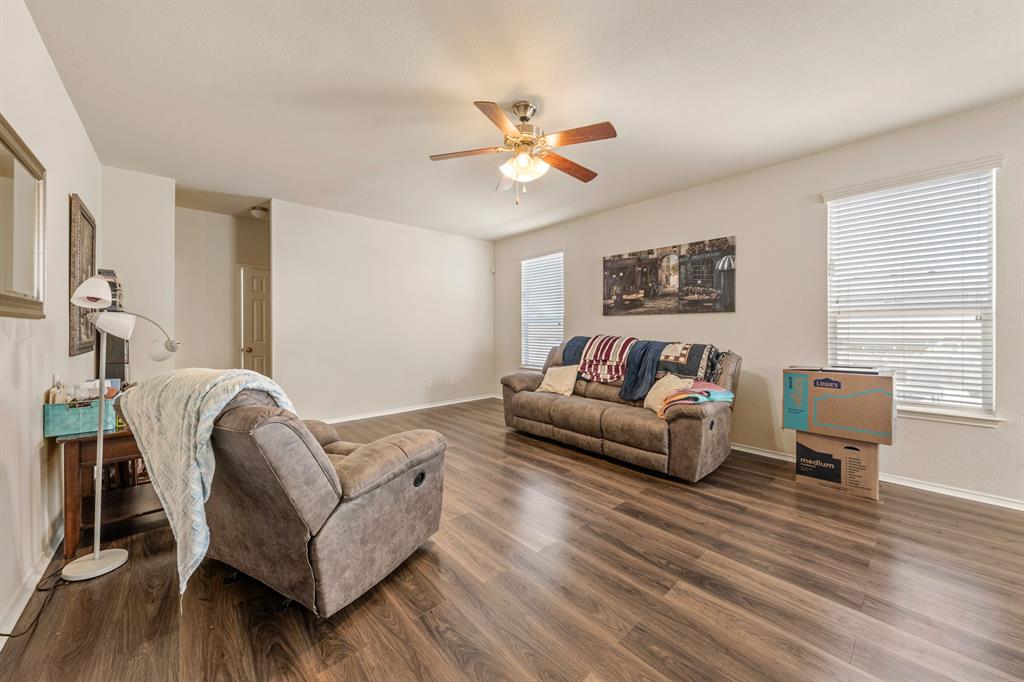 6544 Mundo Drive Waco, TX 76712 - Photo 7 of 21 a living room with furniture and a wooden floor