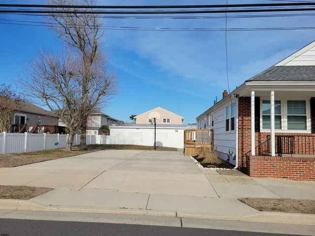 a view of a livingroom with furniture and a flat screen tv