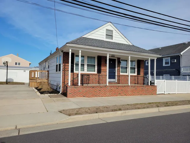 a kitchen with stainless steel appliances kitchen island granite countertop a refrigerator and a stove top oven