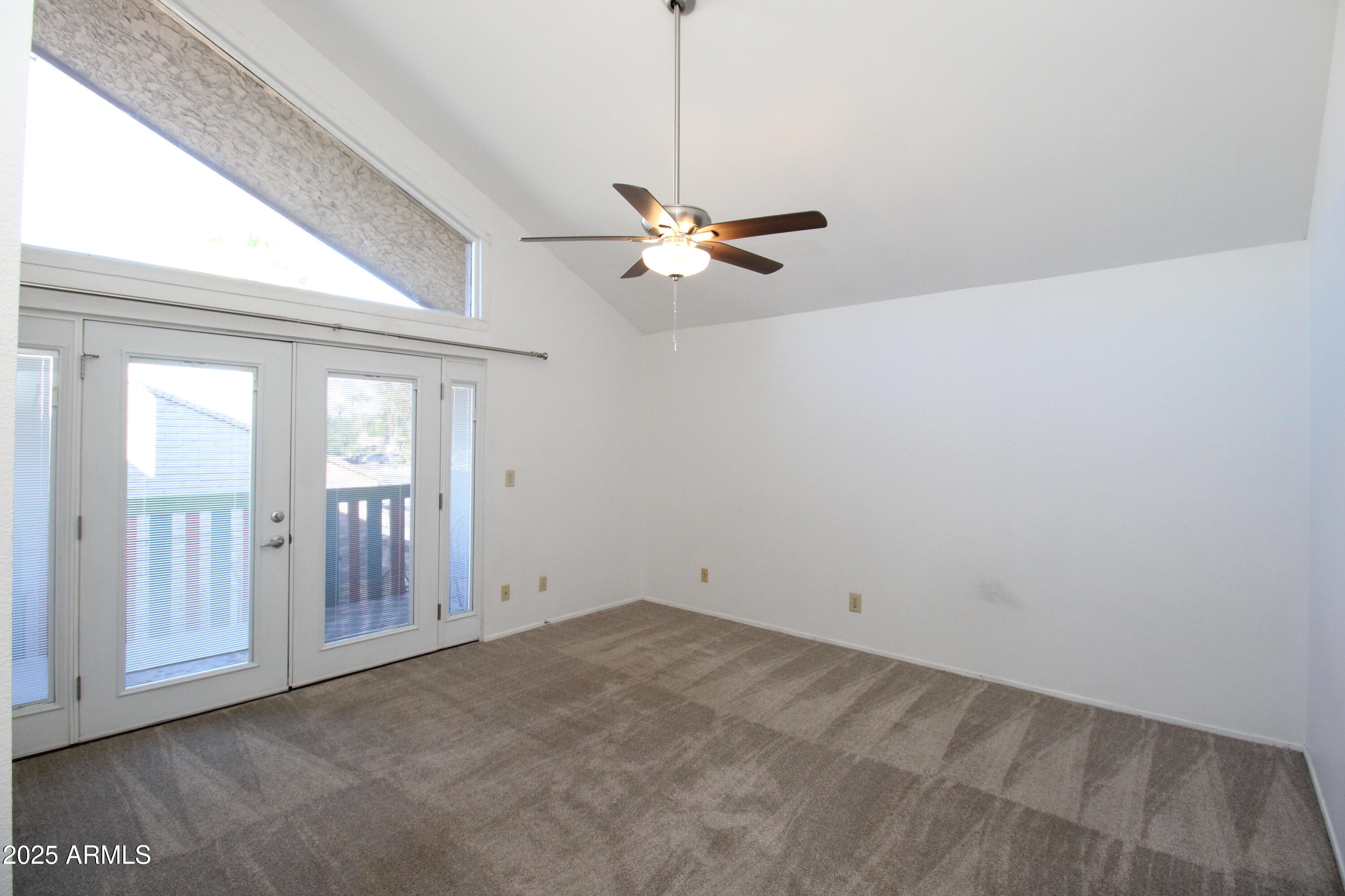 5330 North Central Avenue, Unit 19 Phoenix, AZ 85012 - Photo 13 of 33 a view of a room with a ceiling fan and a window
