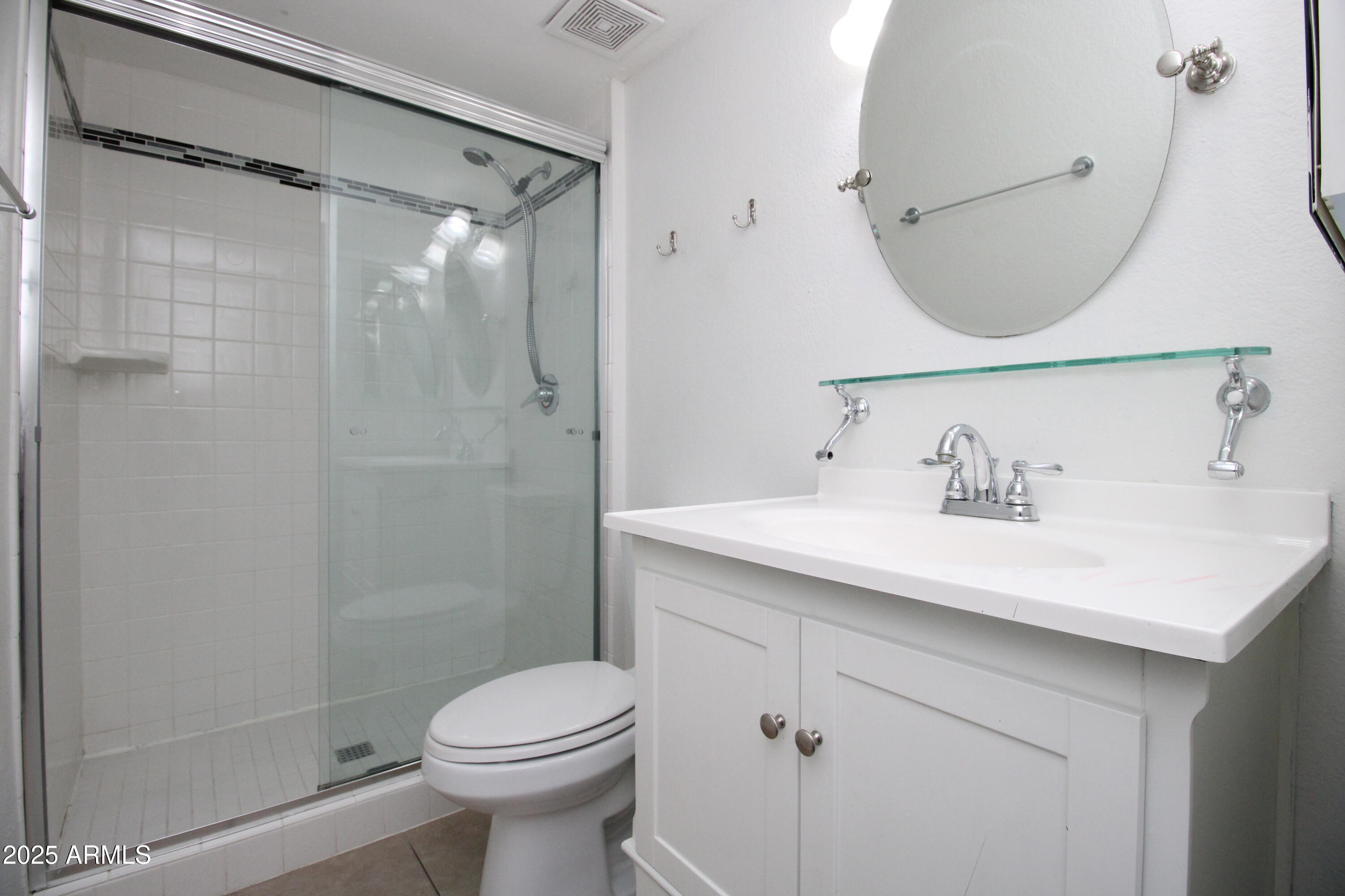 5330 North Central Avenue, Unit 19 Phoenix, AZ 85012 - Photo 20 of 33 a bathroom with a sink toilet and shower