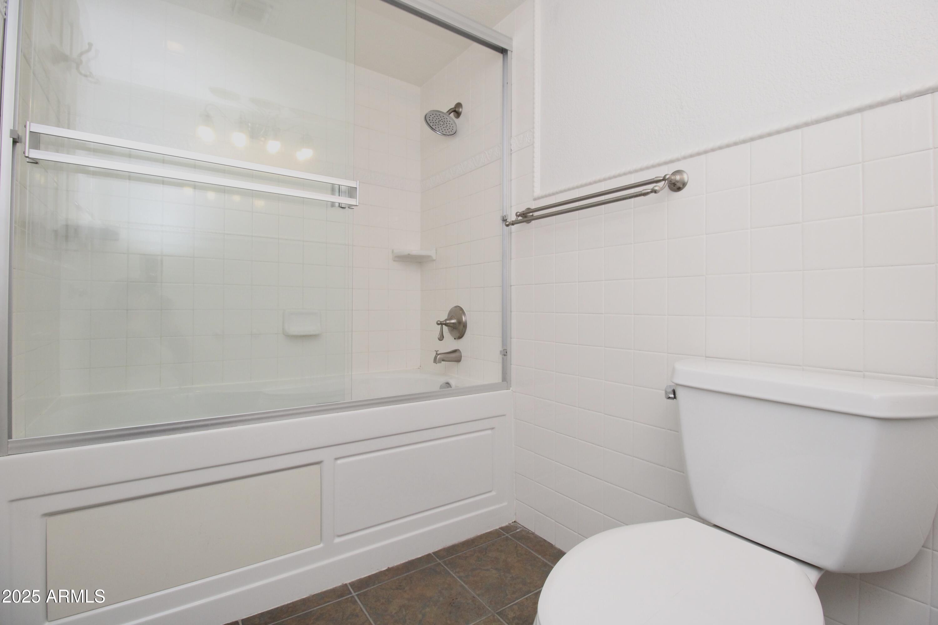 5330 North Central Avenue, Unit 19 Phoenix, AZ 85012 - Photo 21 of 33 a bathroom with a toilet and a shower