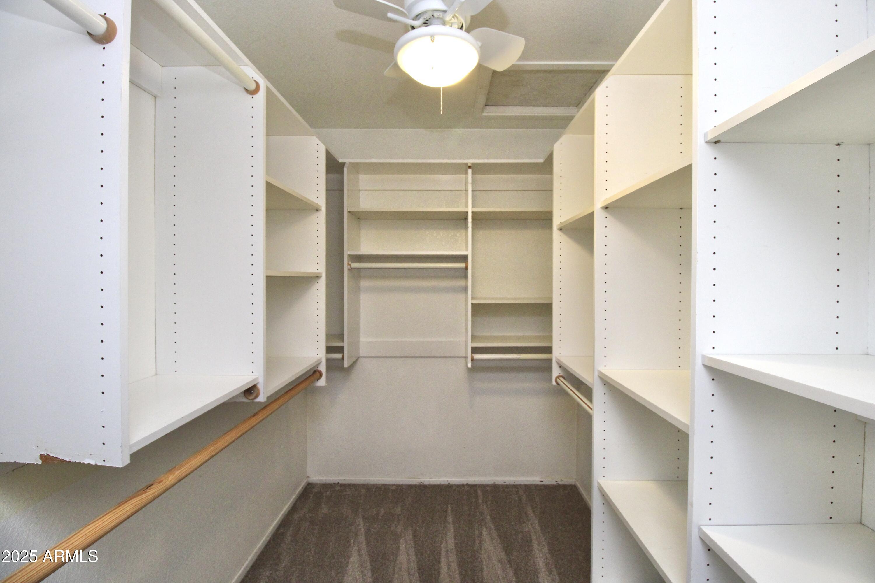 5330 North Central Avenue, Unit 19 Phoenix, AZ 85012 - Photo 23 of 33 a view of walk in closet with empty racks