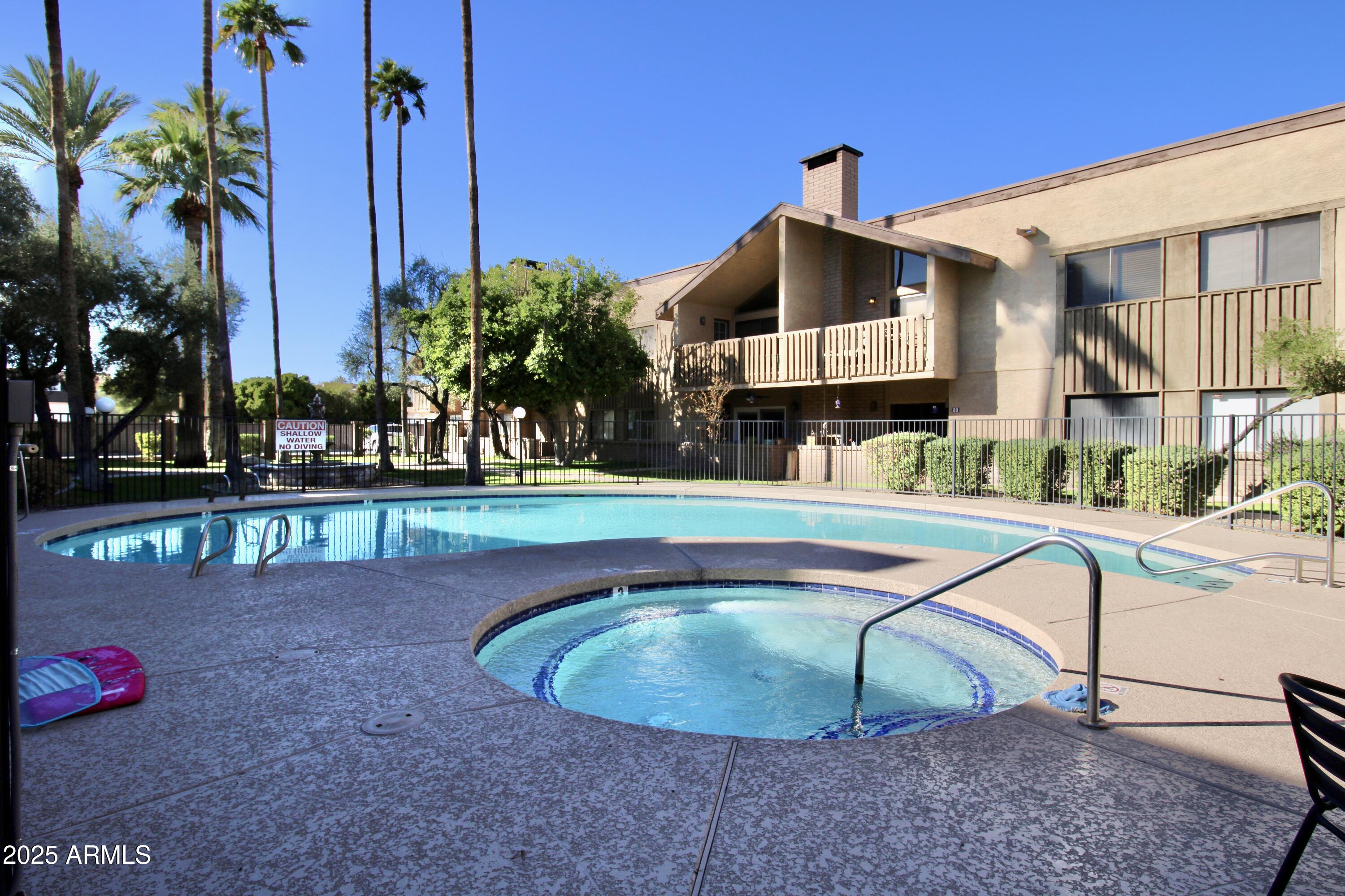 5330 North Central Avenue, Unit 19 Phoenix, AZ 85012 - Photo 26 of 33 a view of a house with a swimming pool