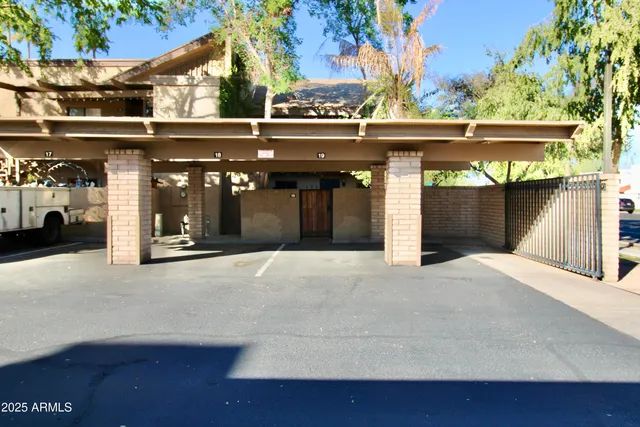 a couple of cars parked in front of building