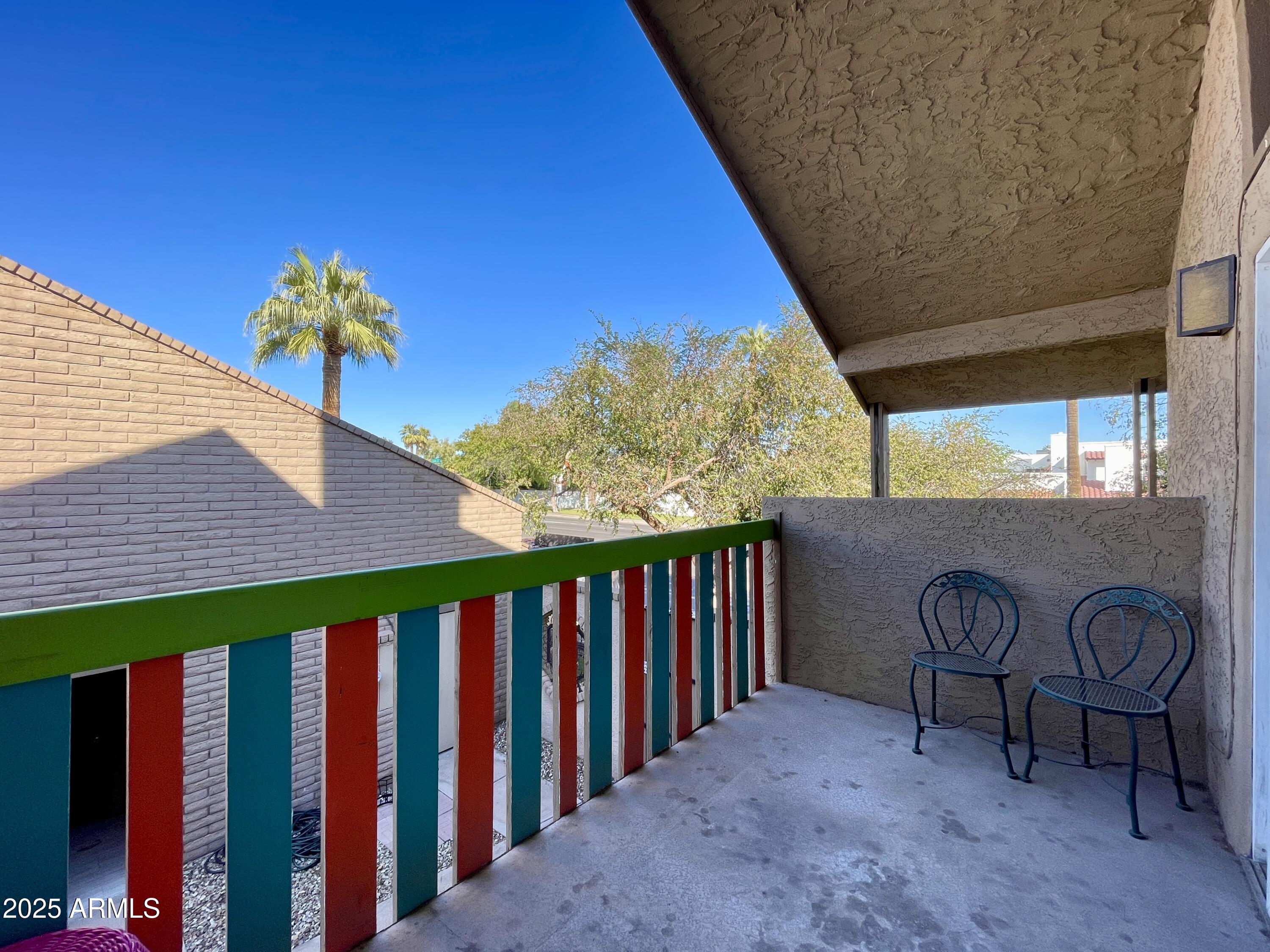 5330 North Central Avenue, Unit 19 Phoenix, AZ 85012 - Photo 29 of 33 a view of a porch with furniture and floor to ceiling window