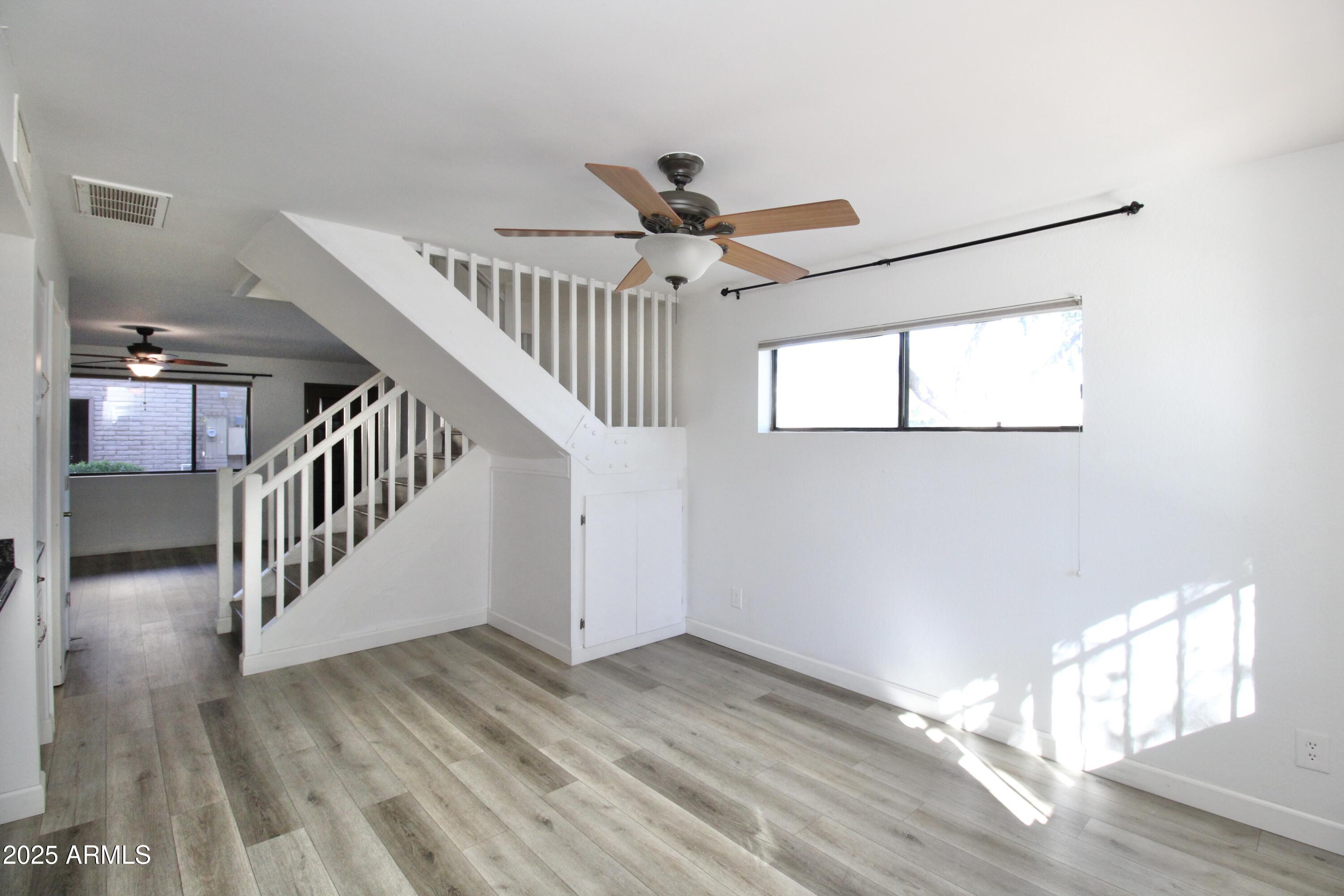 5330 North Central Avenue, Unit 19 Phoenix, AZ 85012 - Photo 9 of 33 a view of entryway and hall with wooden floor