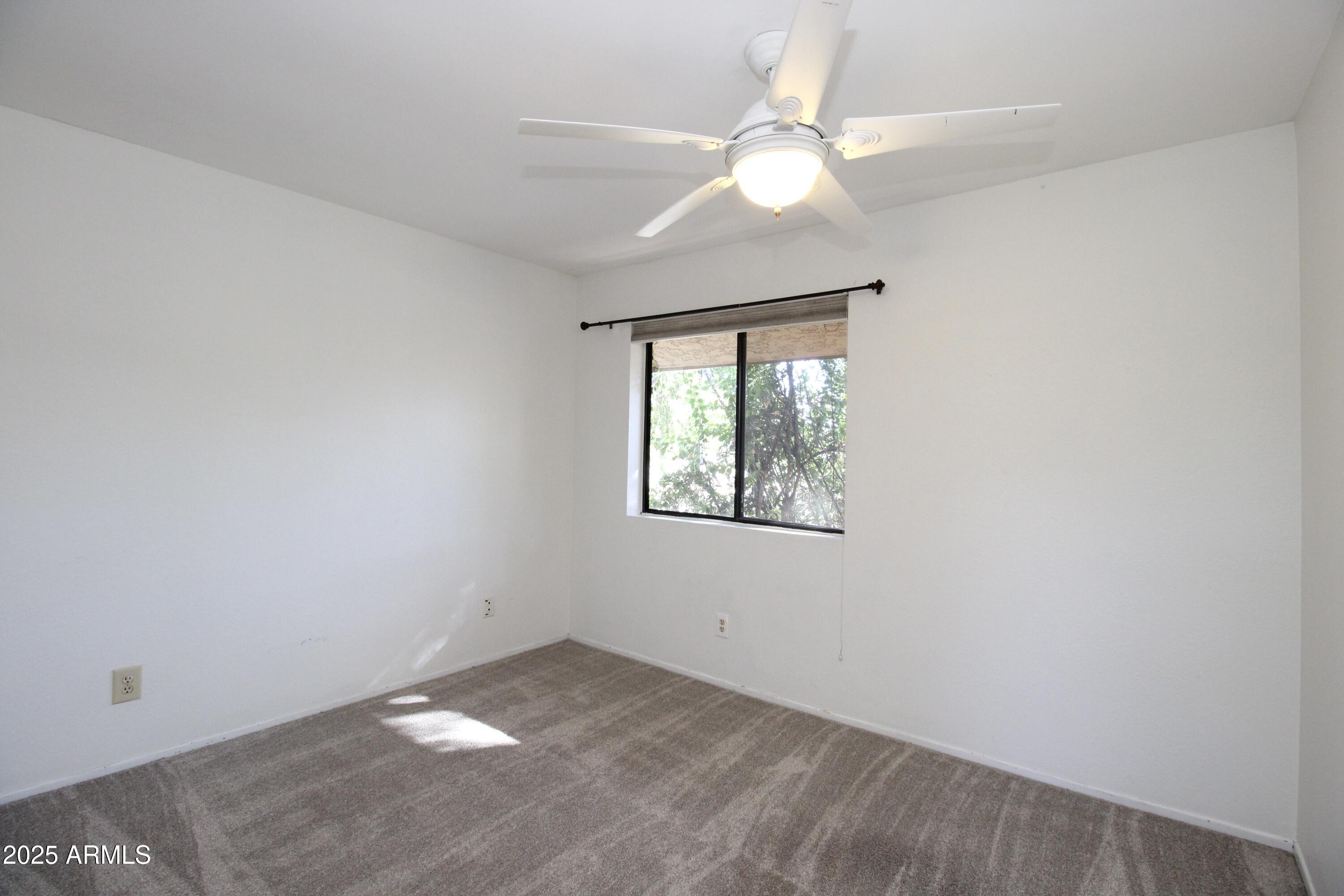 5330 North Central Avenue, Unit 19 Phoenix, AZ 85012 - Photo 10 of 33 an empty room with a window