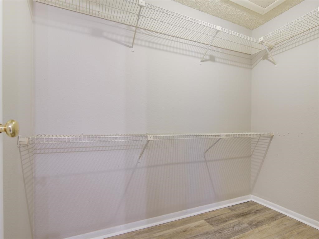 1900 Bay Area Boulevard, Unit T194 Houston, TX 77058 - Photo 12 of 21 a view of a room with racks on the wall