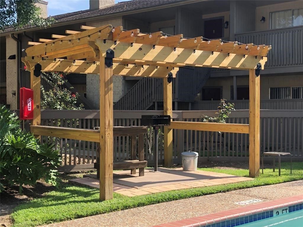 1900 Bay Area Boulevard, Unit T194 Houston, TX 77058 - Photo 17 of 21 a view of a house with a small yard and plants