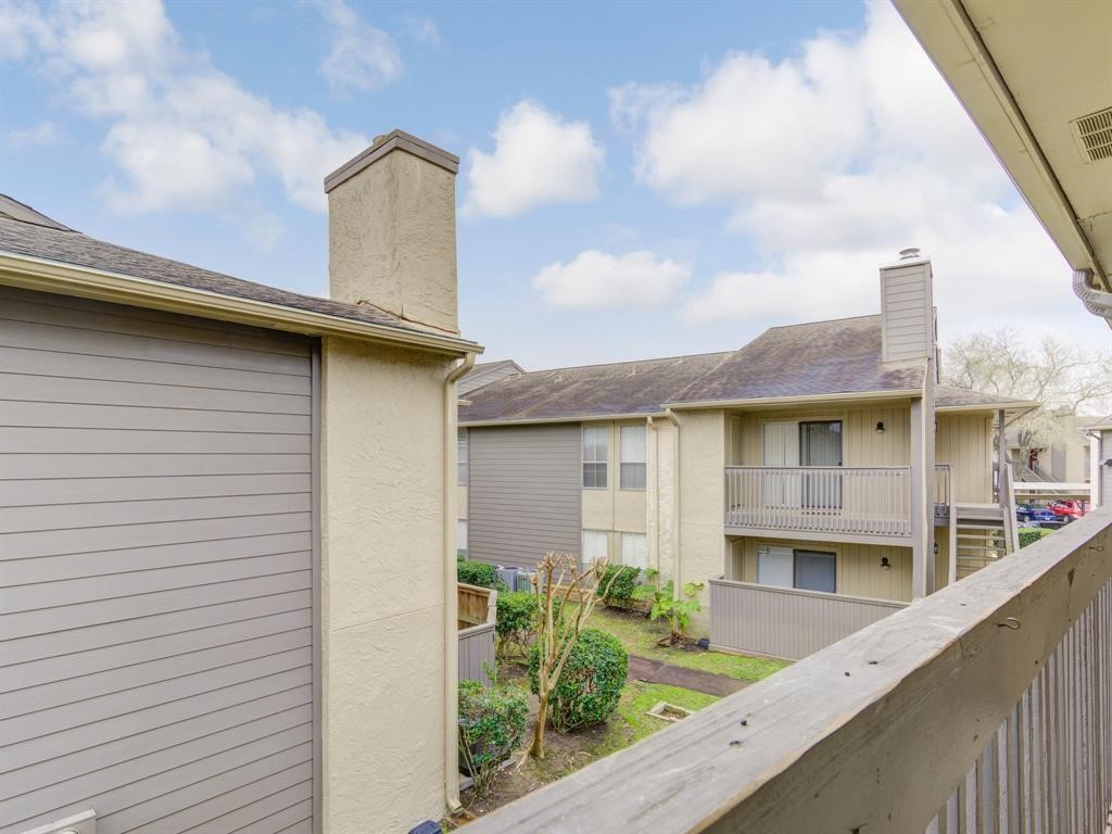 1900 Bay Area Boulevard, Unit T194 Houston, TX 77058 - Photo 3 of 21 a front view of a house with plants