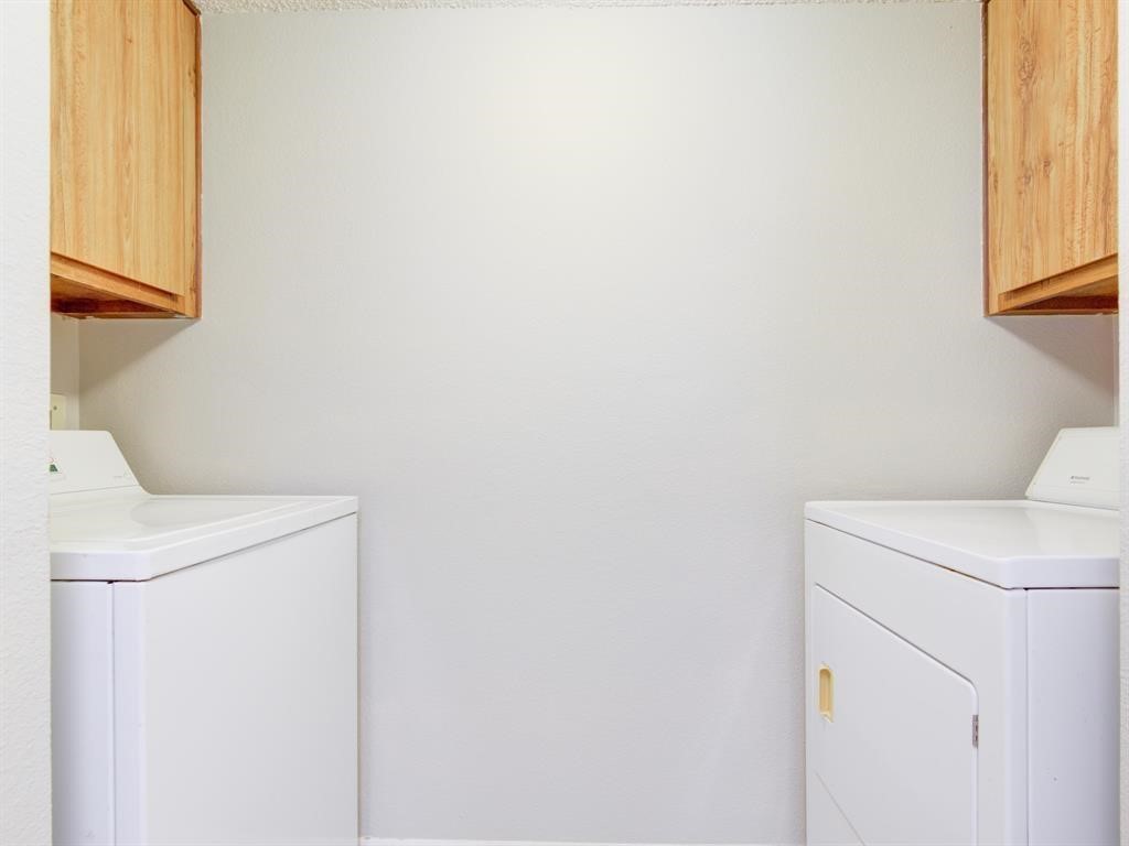 1900 Bay Area Boulevard, Unit T194 Houston, TX 77058 - Photo 8 of 21 a utility room with dryer and washer