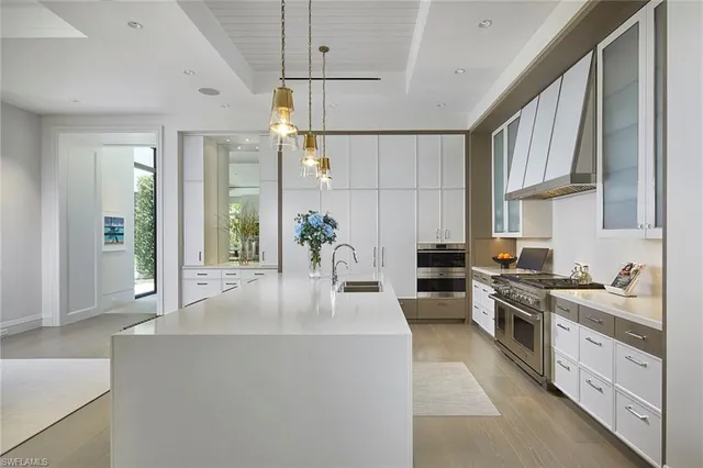a living room with fireplace furniture and a large window