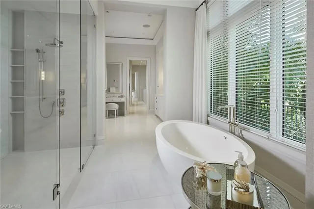 a spacious bathroom with a double vanity sink double and mirror