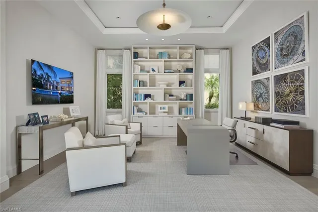 a view of staircase with railing and a large window