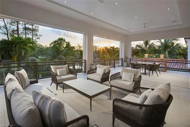 a view of a swimming pool with a patio and a garden