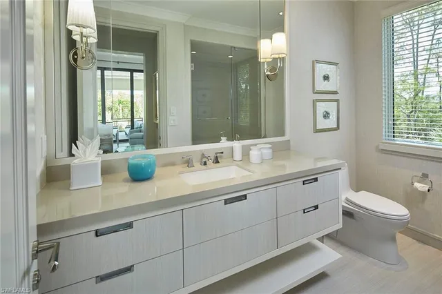 a bed room with two beds and a chair