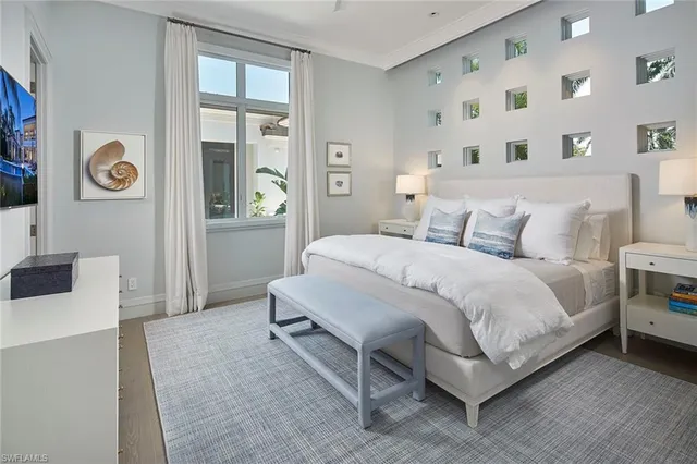 a bathroom with a sink mirror and toilet
