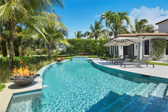 a view of a house with backyard and porch