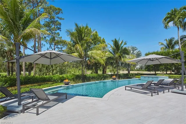 a view of swimming pool with chairs