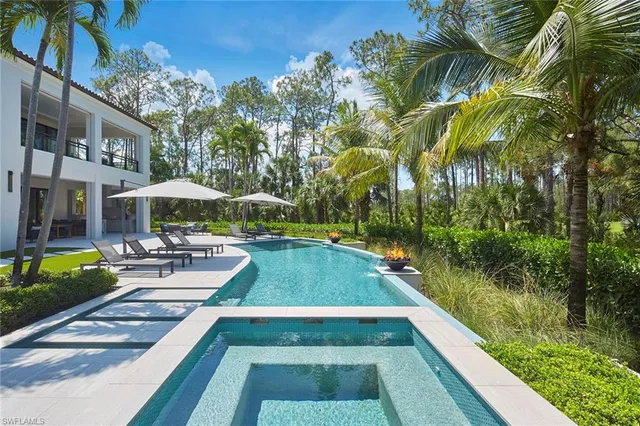 a sign that is sitting in front of a house