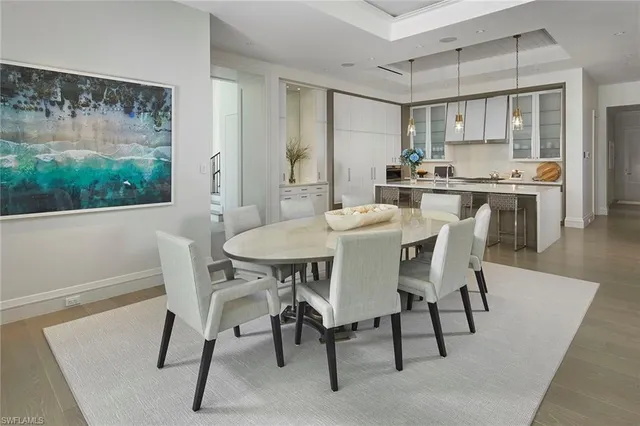 a kitchen with stainless steel appliances kitchen island granite countertop a sink and cabinets