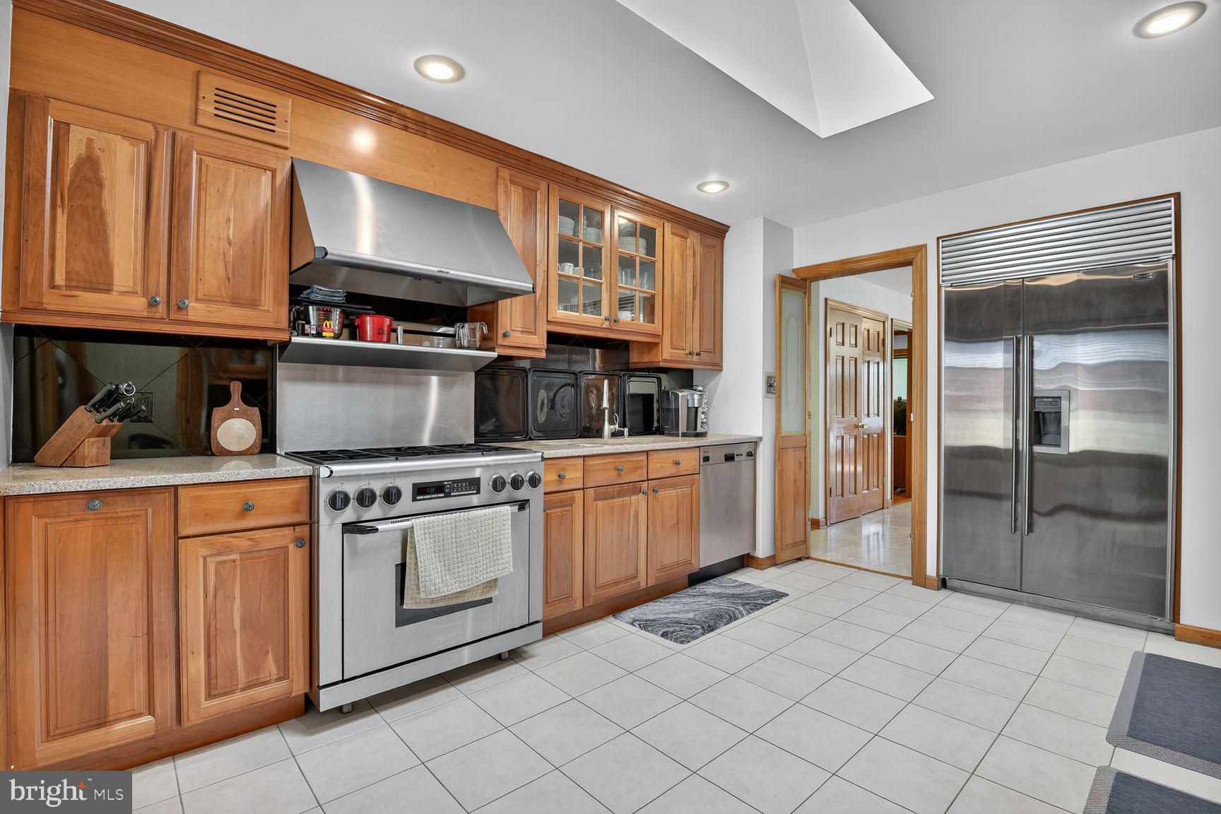 5800 Plainview Road Bethesda, MD 20817 - Photo 8 of 30 a kitchen with stainless steel appliances granite countertop a refrigerator and a stove top oven