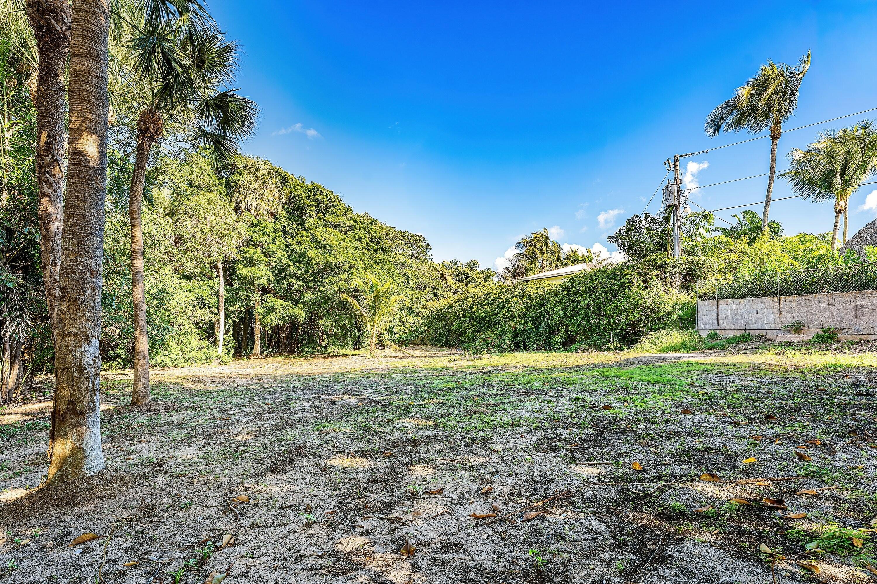 4 Whitney Way Ocean Ridge, FL 33435 - Photo 12 of 12 a view of a yard with a house