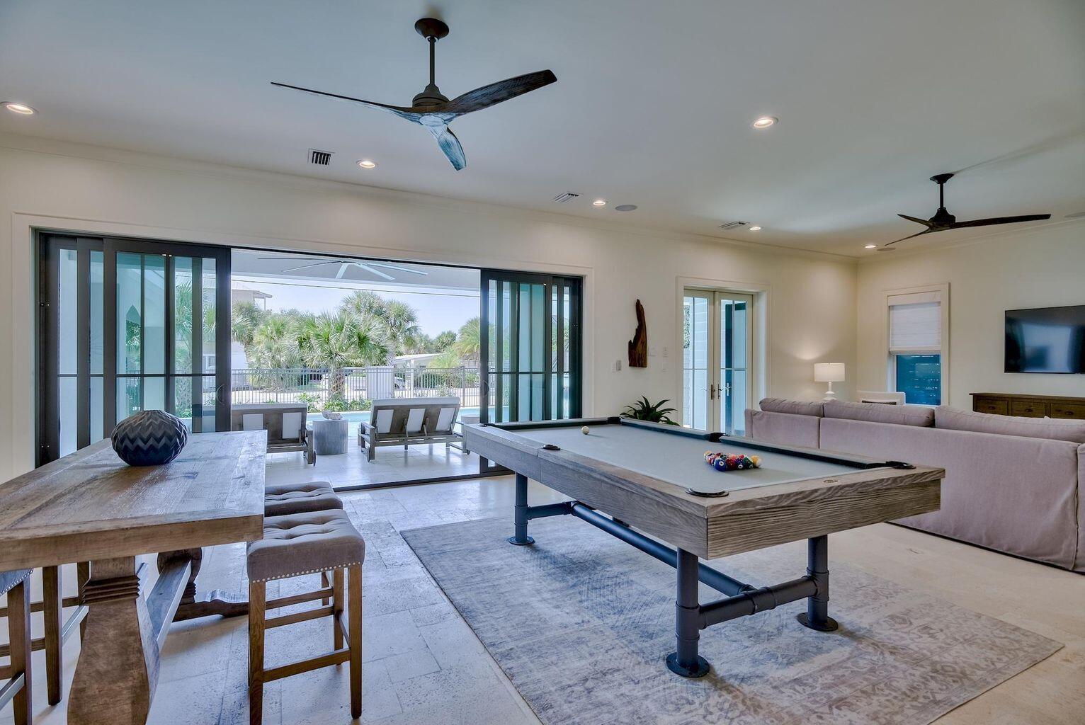 70 West Seahorse Circle Santa Rosa Beach, FL 32459 - Photo 22 of 25 a living room with furniture a table and a large window