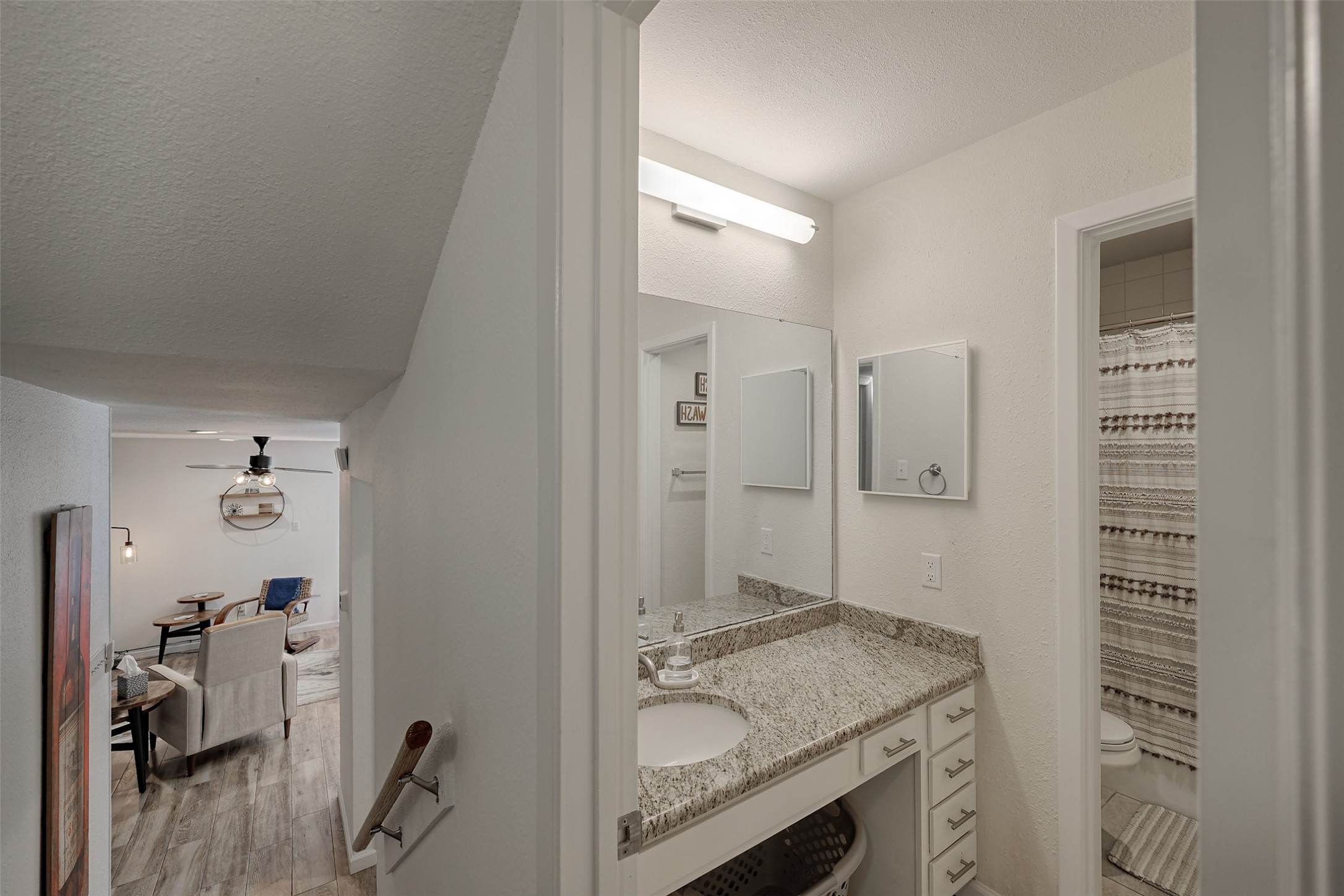 12500 Melville Drive, Unit 123C Montgomery, TX 77356 - Photo 12 of 31 a bathroom with a granite countertop sink a mirror and shower