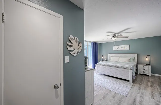 a spacious bedroom with a bed and a window