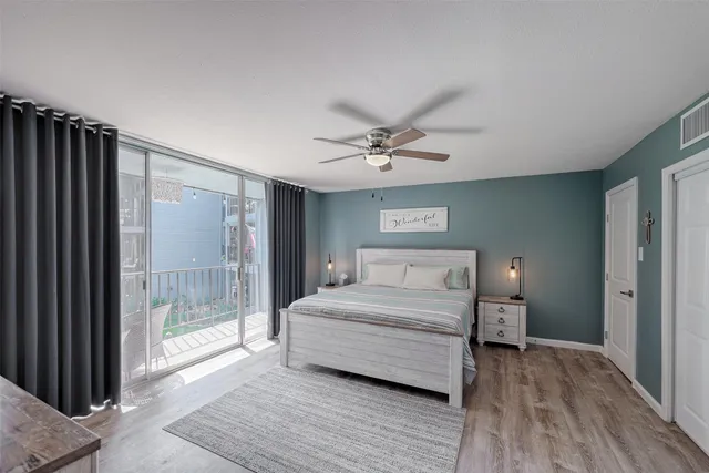 a spacious bedroom with a bed and a window