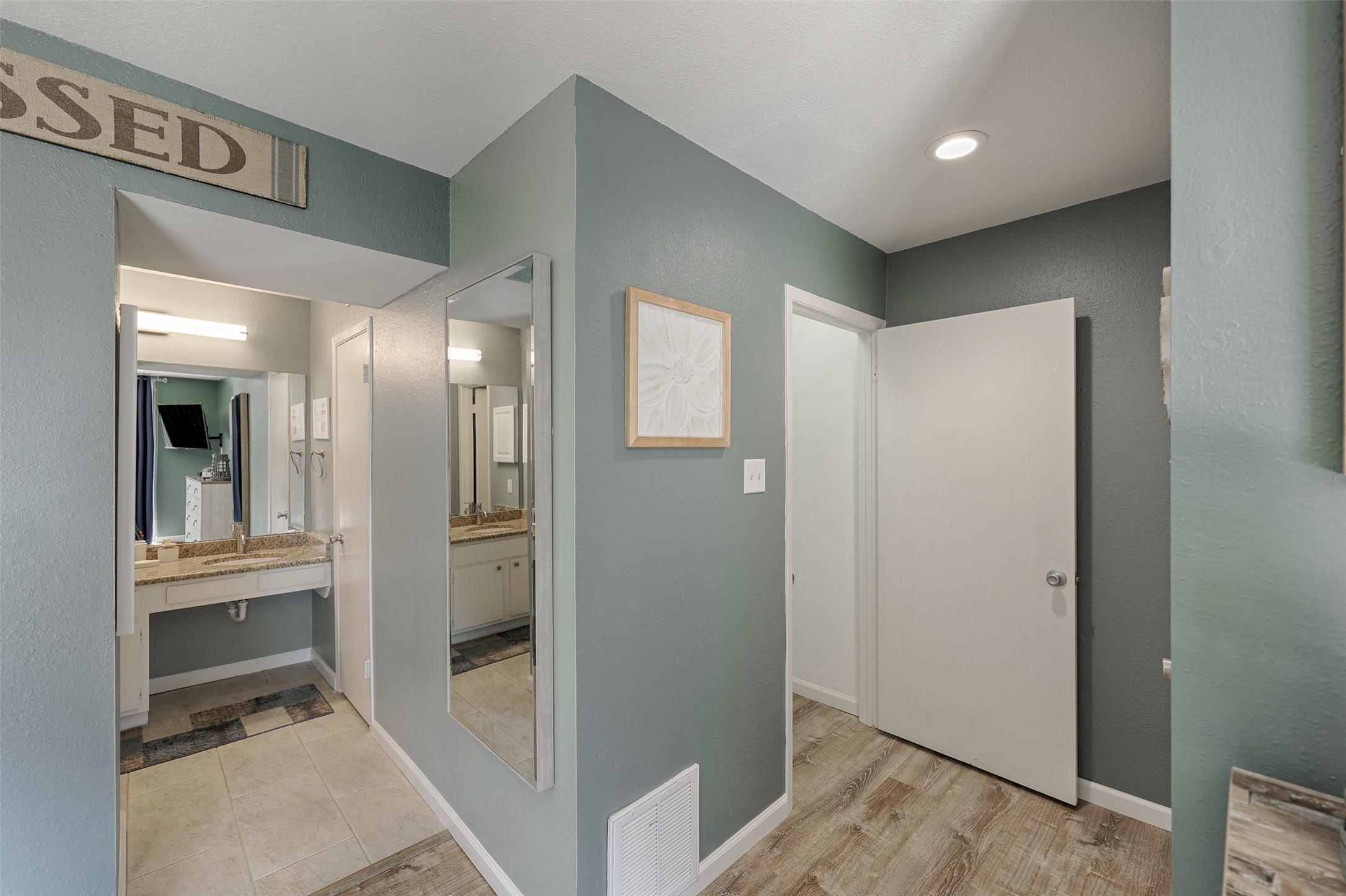 12500 Melville Drive, Unit 123C Montgomery, TX 77356 - Photo 18 of 31 a view of a hallway with wooden floor