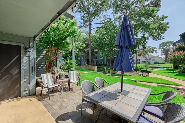 a view of yard with seating area and furniture