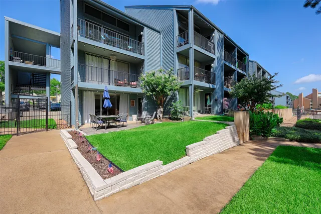 a view of a building with a yard