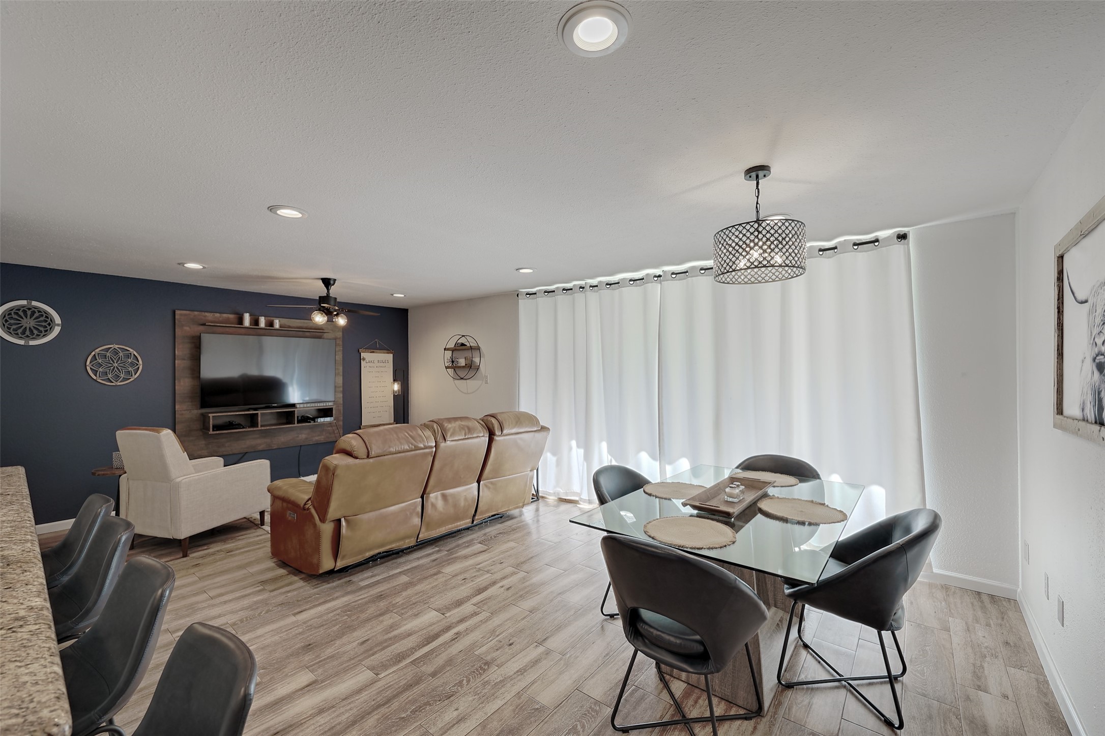 12500 Melville Drive, Unit 123C Montgomery, TX 77356 - Photo 3 of 31 a living room with furniture and a wooden floor