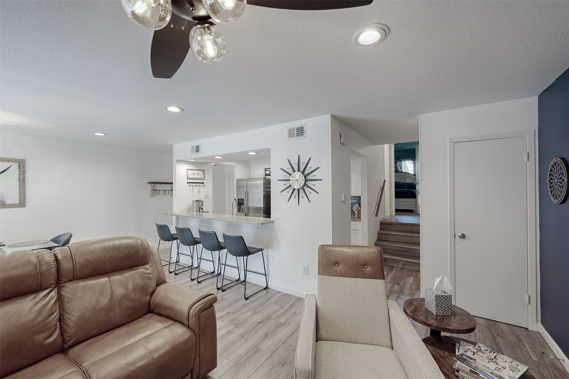 12500 Melville Drive, Unit 123C Montgomery, TX 77356 - Photo 6 of 31 a living room with furniture a couch and chandelier