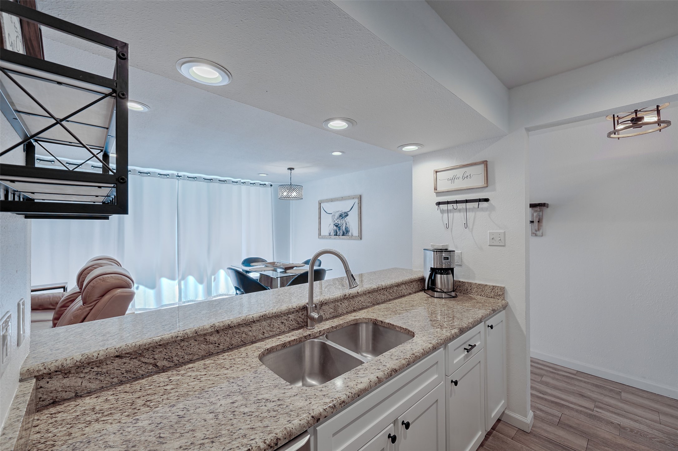 12500 Melville Drive, Unit 123C Montgomery, TX 77356 - Photo 8 of 31 a kitchen with granite countertop a sink and a refrigerator