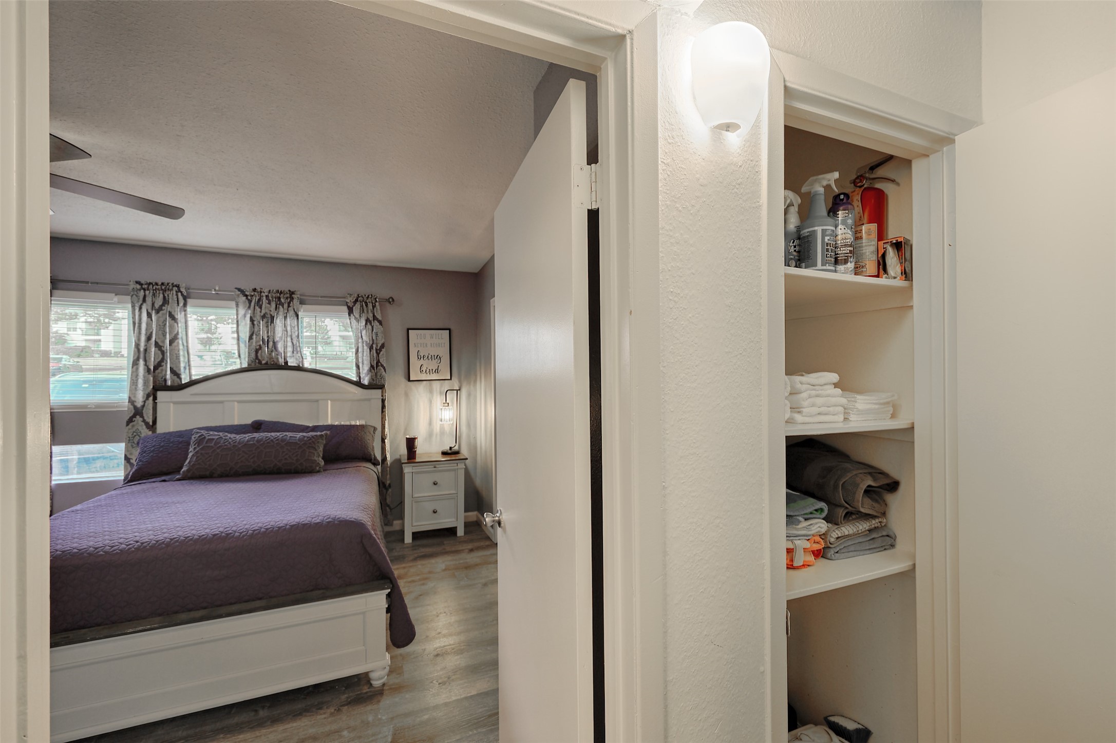 12500 Melville Drive, Unit 123C Montgomery, TX 77356 - Photo 9 of 31 a en suite bathroom with a double bed and a walk in closet